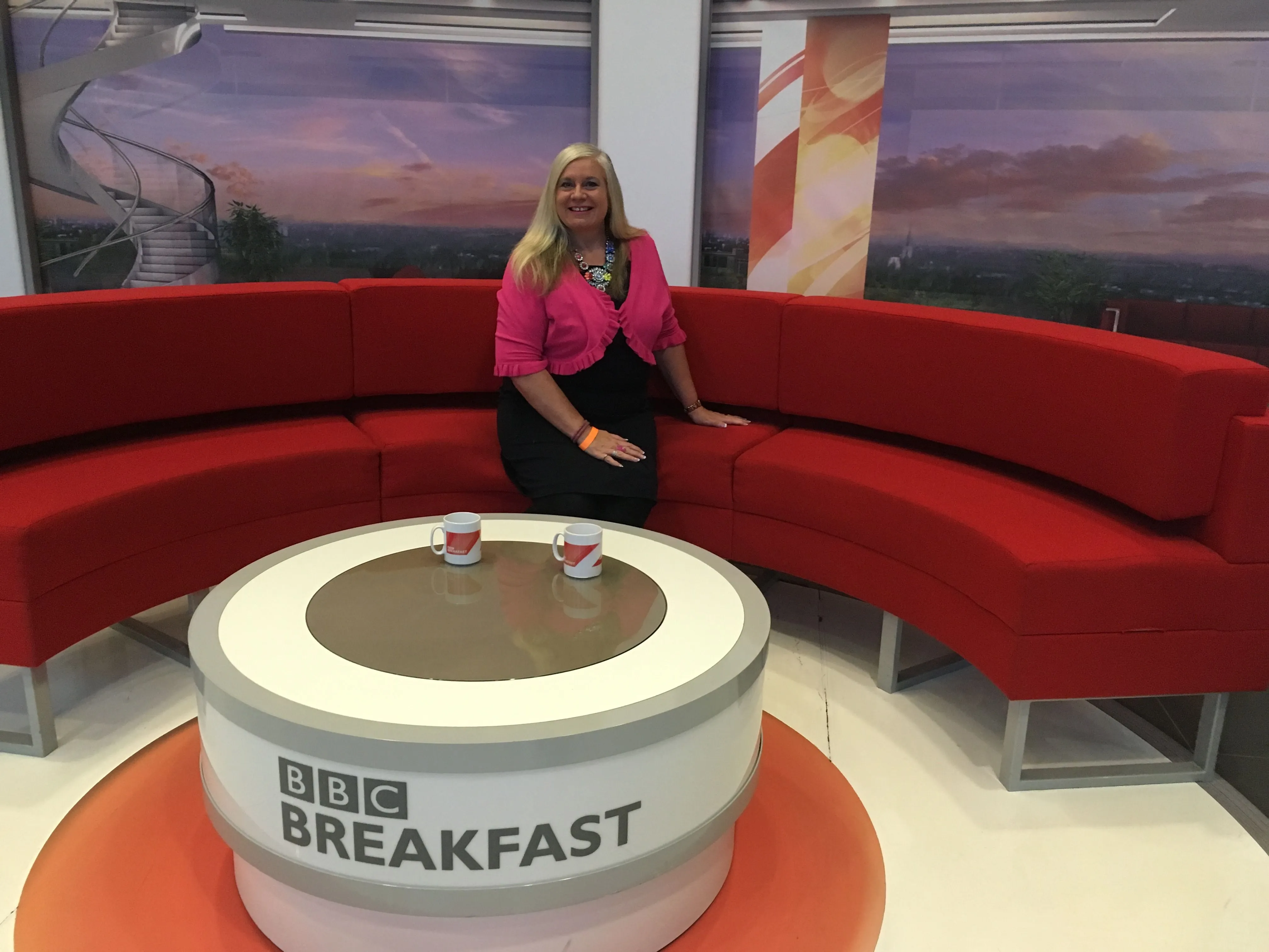 Alison on the BBC Breakfast sofa in the studio.